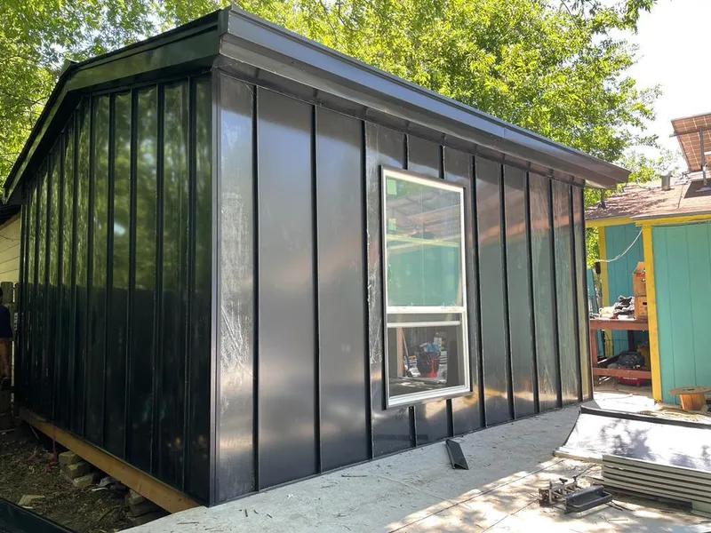 Black standing seam metal wall panels for Roof Inspection in Knightdale